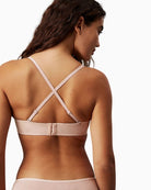 Back view highlighting hook fastening and optional straps on Calvin Klein demi bra