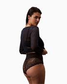 Side view of Calvin Klein Sensual Stretch Lace Shapewear Brief in black showing sheer lace back