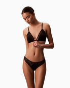 Calvin Klein lace thong with scalloped trim, cut-out back, and logo detail
