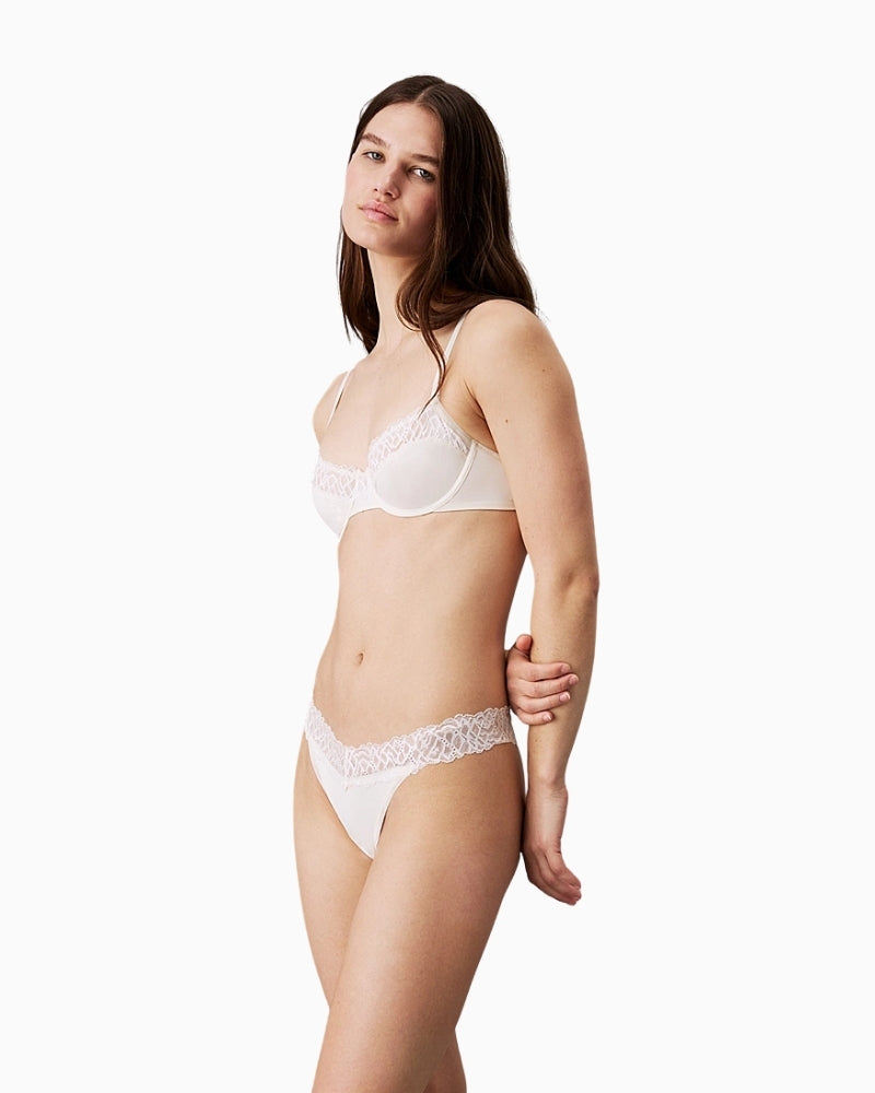 Front view of Calvin Klein thong with dipped panel and elastic trim