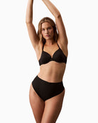 Calvin Klein Stay Put Mesh Sculpted Shapewear Thong in nude with high waist and laser cut edges