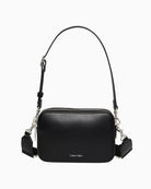 Front view of Calvin Klein taupe pocket bag with webbing straps and structured shape
