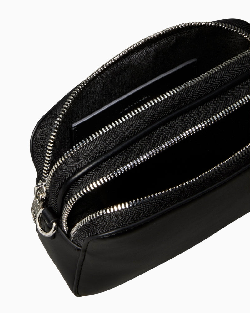 Close-up of webbing strap attachment and pocket stitching details