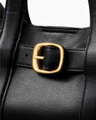 Close-up of webbing strap attachment and smart stitching on tote