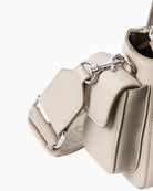 Close‑up of croc pattern detail and CK logo edge on wallet