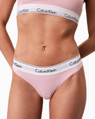 Close-up of Calvin Klein women's pink thong with signature logo waistband