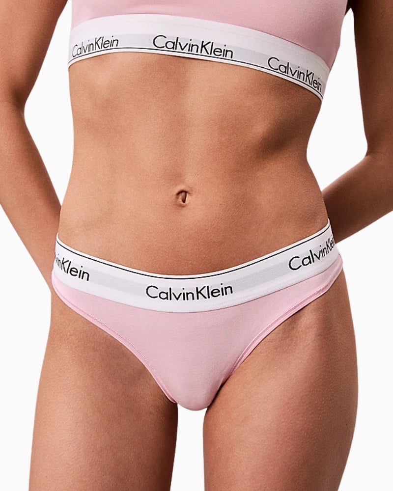 Close-up of Calvin Klein women's pink thong with signature logo waistband