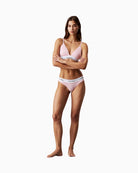 Model wearing Calvin Klein pink bralette and thong set 