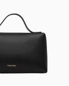 Back view of Calvin Klein black cosmetic bag – Áines Boutique