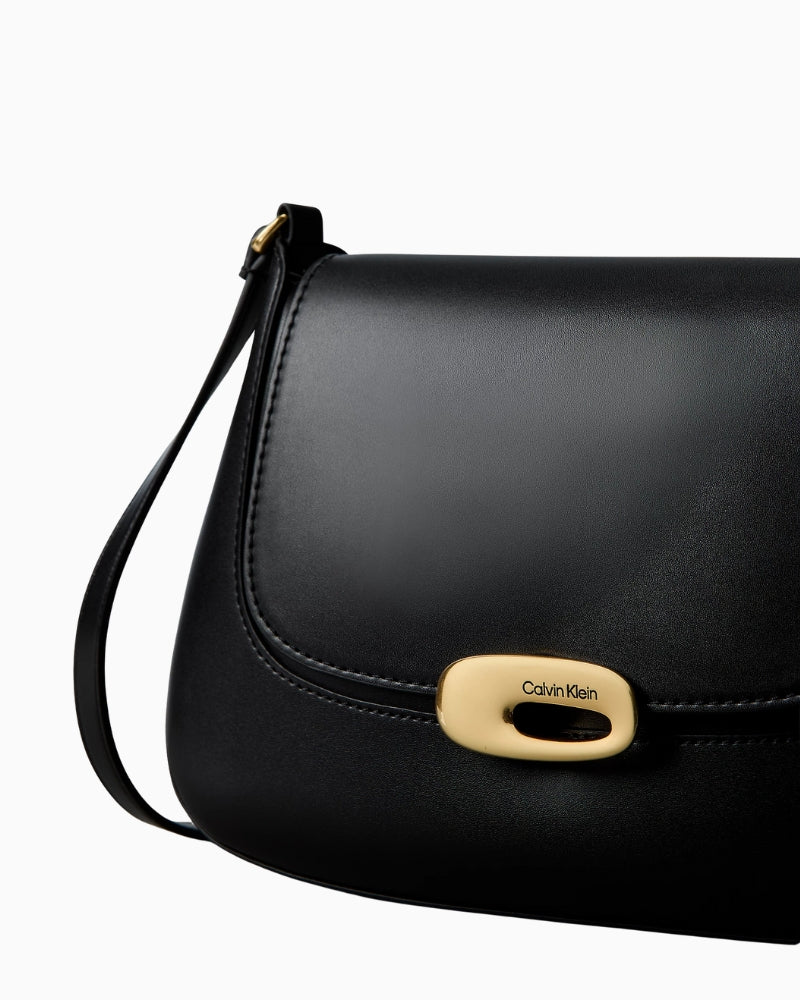 Calvin Klein engraved medium flap crossbody bag black side with strap – Áines Boutique