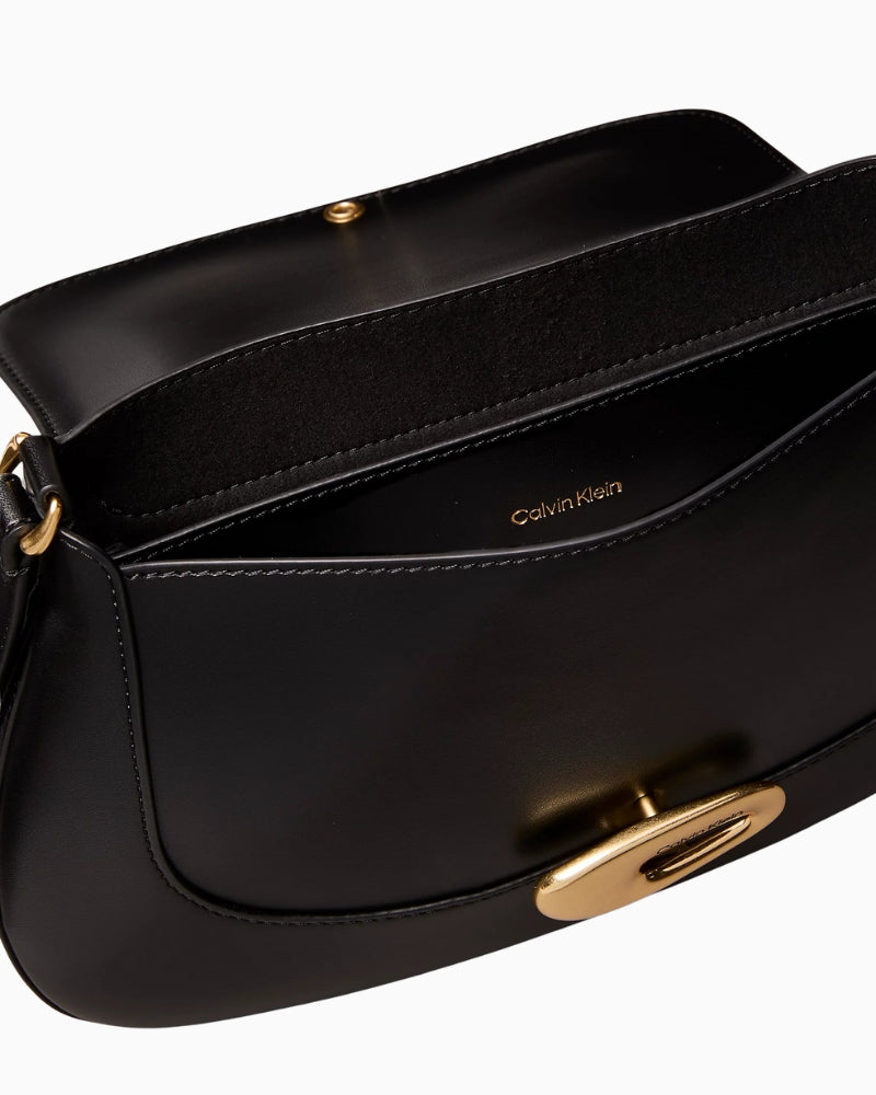 Calvin Klein engraved medium flap crossbody bag black interior pocket detail – Áines Boutique