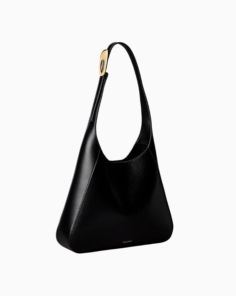 Calvin Klein engraved medium shoulder bag black side view with strap – Áines Boutique