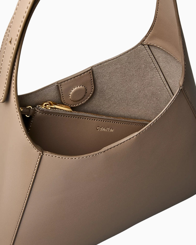 Calvin Klein engraved medium shoulder bag taupe interior view – Áines Boutique