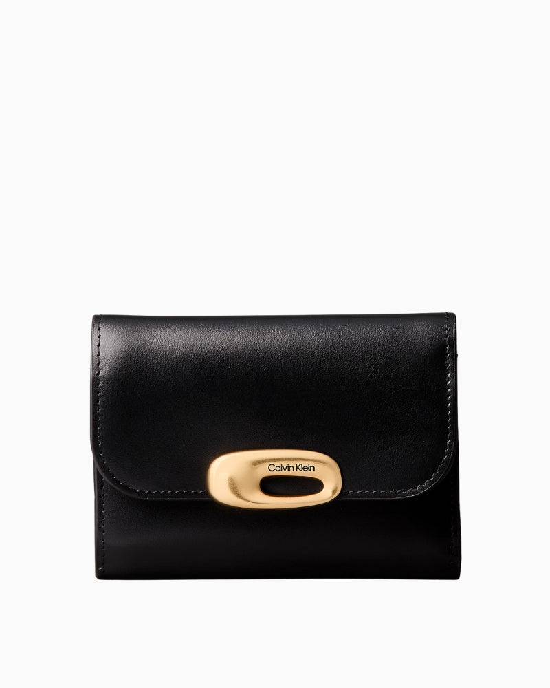 Calvin Klein engraved trifold wallet, front view showing flap and logo hardware – Áines Boutique