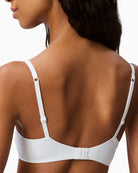 Close-up of Calvin Klein white bra showing soft fabric and full coverage cups