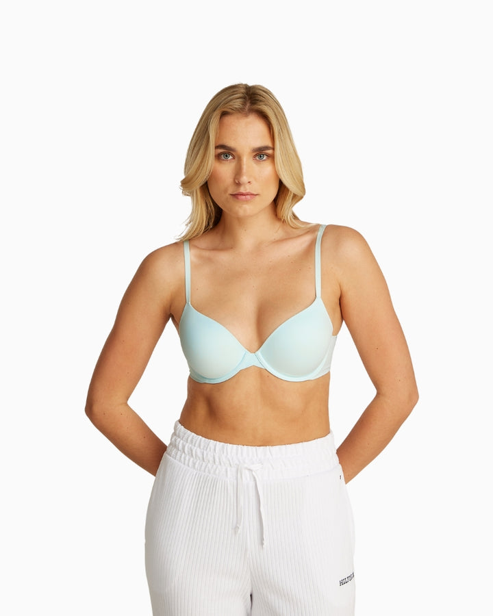 Model wearing Calvin Klein full coverage bra in soft green moonlight jade