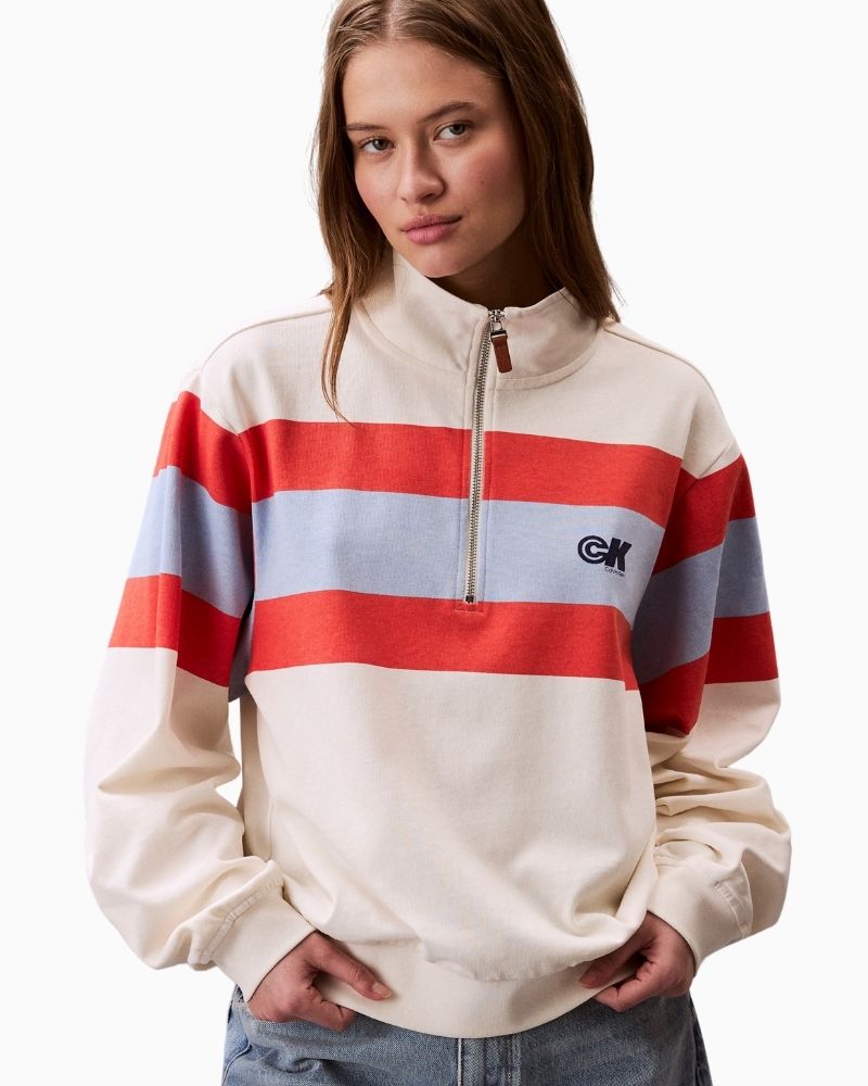 Front of Calvin Klein rugby stripe top in off white with 1/4 zip and stand collar