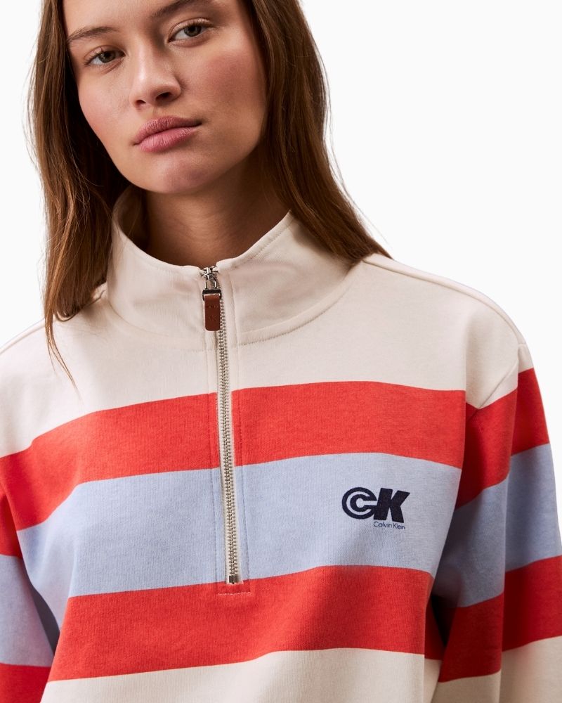 Close up view of cotton rugby jersey with bold stripe and zip detail