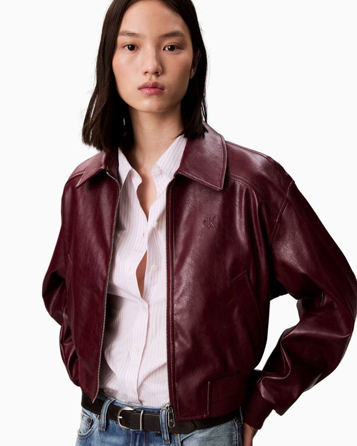 Close-up of faux leather texture and Calvin Klein branding