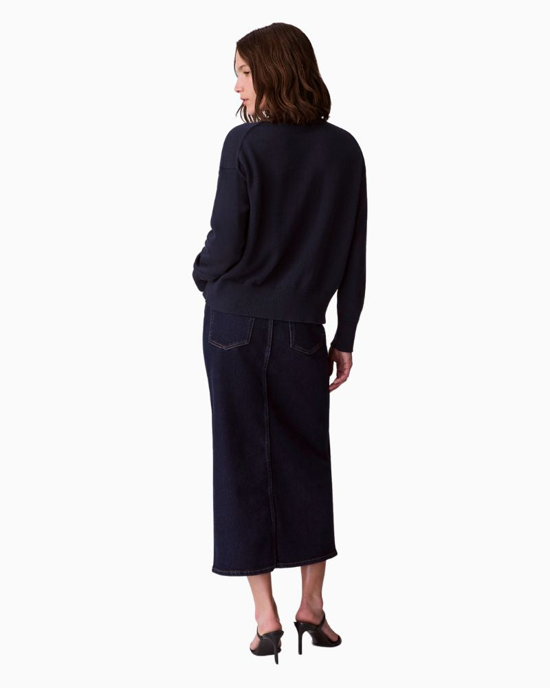 Back of CK graphic top styled with jeans for a relaxed everyday look