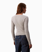 Back view of slim cotton Calvin Klein top with long sleeves and soft fit