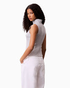 Side view of slim fit top showing clean silhouette and sporty zip detail