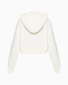 Back of women’s white hoodie showing straight cut and relaxed fit in textured cotton blend