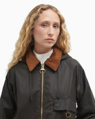 Close-up of corduroy collar and front zip