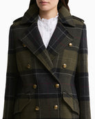Close-up of shoulder epaulette on Barbour checked wool coat