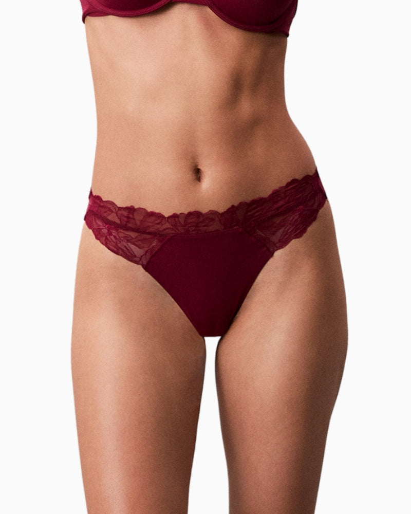 Close up of Calvin Klein pink thong with stretch waistband and smooth finish