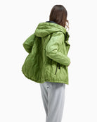 Back view of green quilted District jacket with adjustable hood