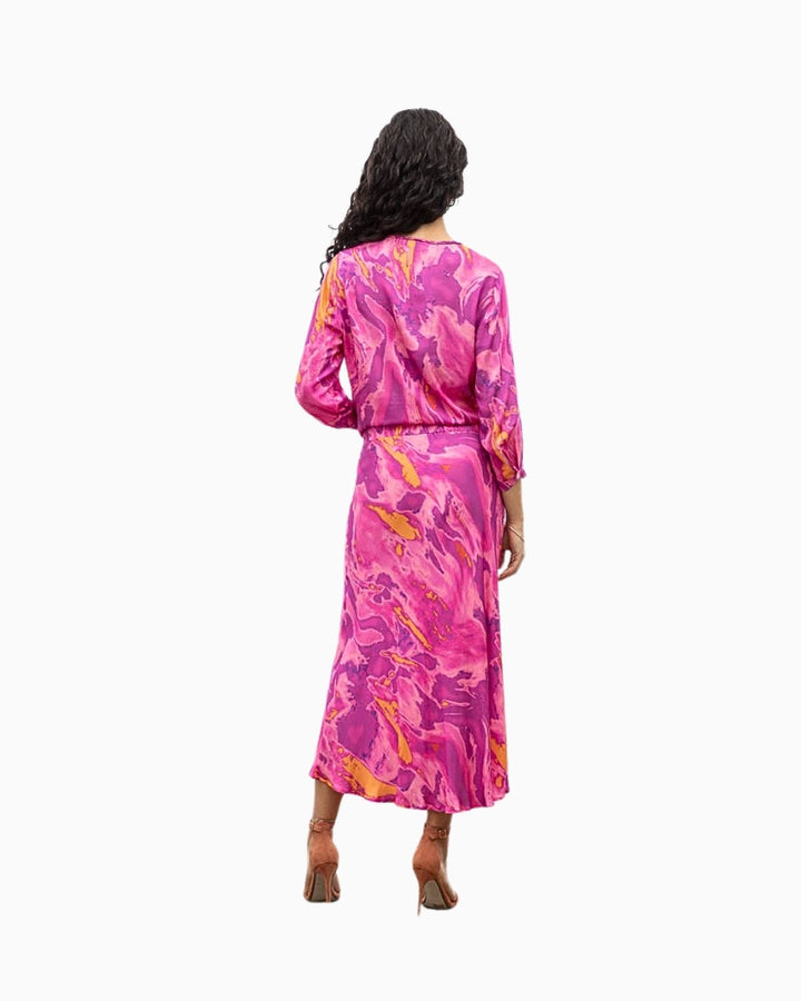 Flowy silhouette of pink tie dye blouse styled in a coordinated set