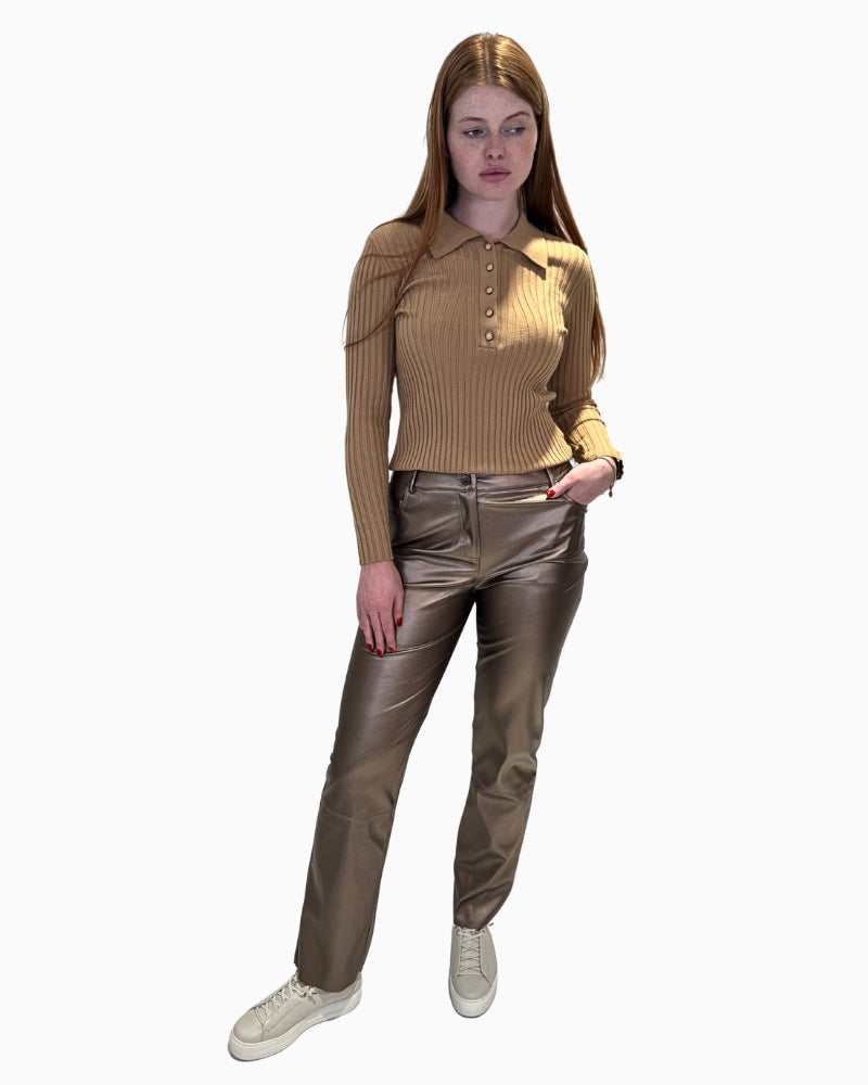 Model wearing Eva Kayan Ribbed Polo Jumper with metallic trousers