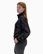 Side view of grey Eva Kayan sparkle jumper showing relaxed fit and roll neck