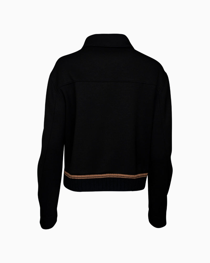 Back view of sporty Faber jacket with soft knit panel and shaped silhouette