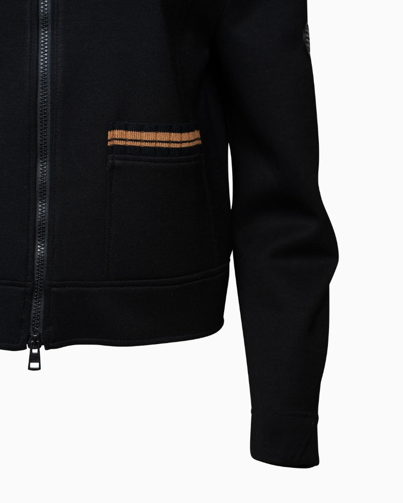 Close-up of two-way zipper and logo sleeve coin on Faber scuba jacket