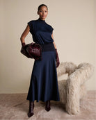 Florere Knit & Satin Midi Skirt in Navy satin seam detail