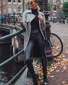 Sleek high-waisted full-length pants in black faux leather by Freddy