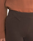 Close-up of waistband and pocket detail on chocolate brown Freddy trousers