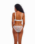 Back view of white lace bra with adjustable straps and hook closure