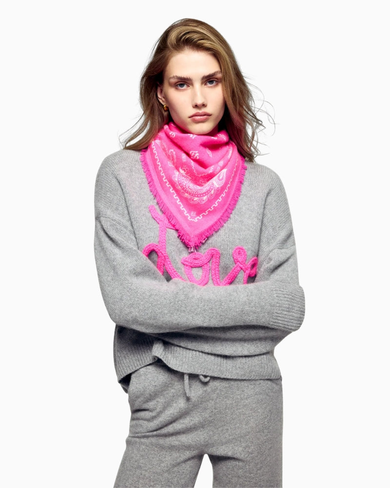 Model wearing From Future pink cashmere bandana scarf in soft cosmic pink shade