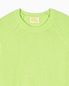 Detail view of neckline and fine knit finish on green cashmere sweater