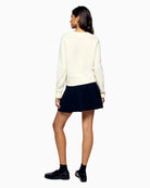 Back view showing ribbed hem and relaxed shape