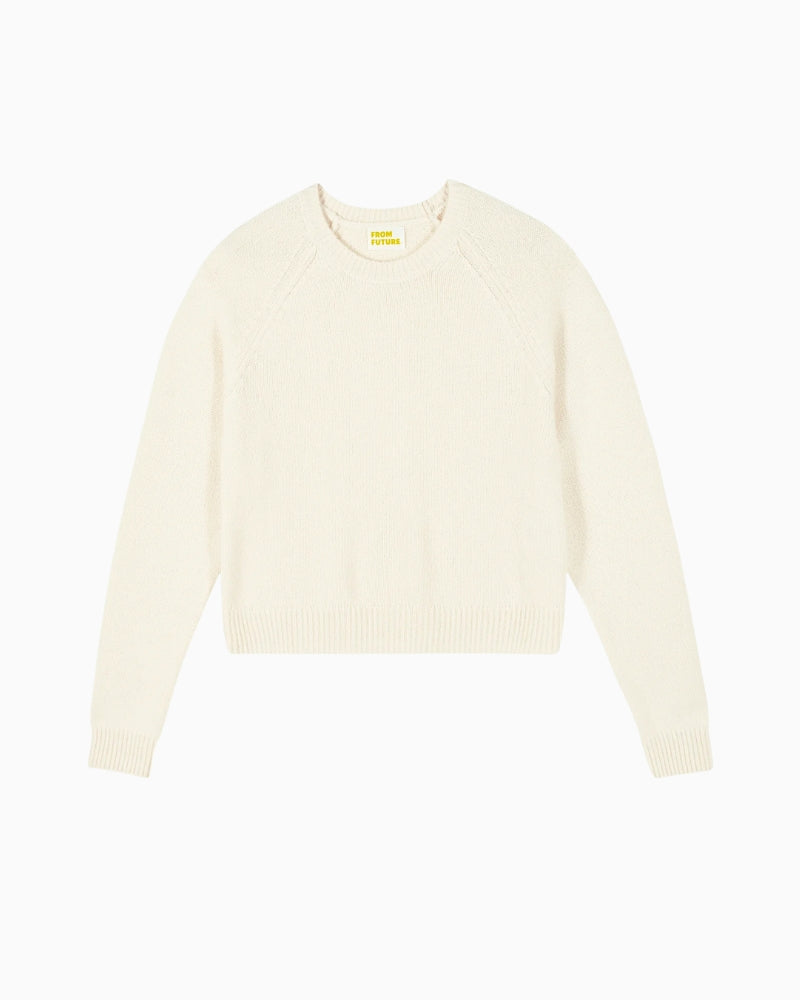 Front view of cropped slim-fit cashmere jumper in ecru