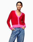 Front view of From Future red cashmere cardigan with contrast trim and V-neckline