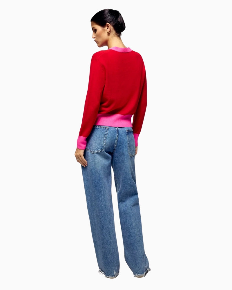 Back view of red GCS-certified cashmere cardigan showing ribbed hem