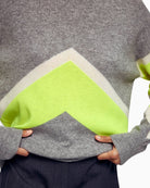 Close-up of ribbed mock neck and soft 2-ply knit cashmere texture