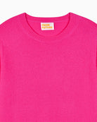 Detail of soft cashmere knit texture in bright solar pink
