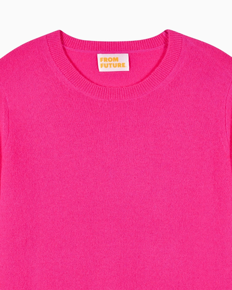 Detail of soft cashmere knit texture in bright solar pink