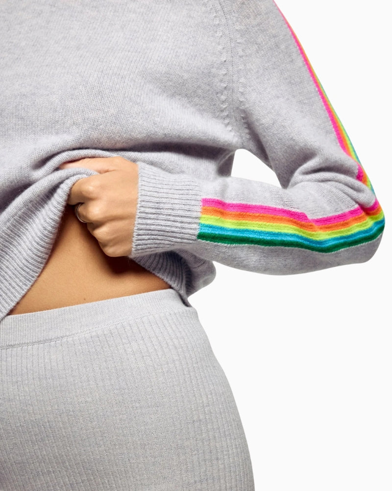 Close-up of sleeve stripe detail on light grey cashmere sweater